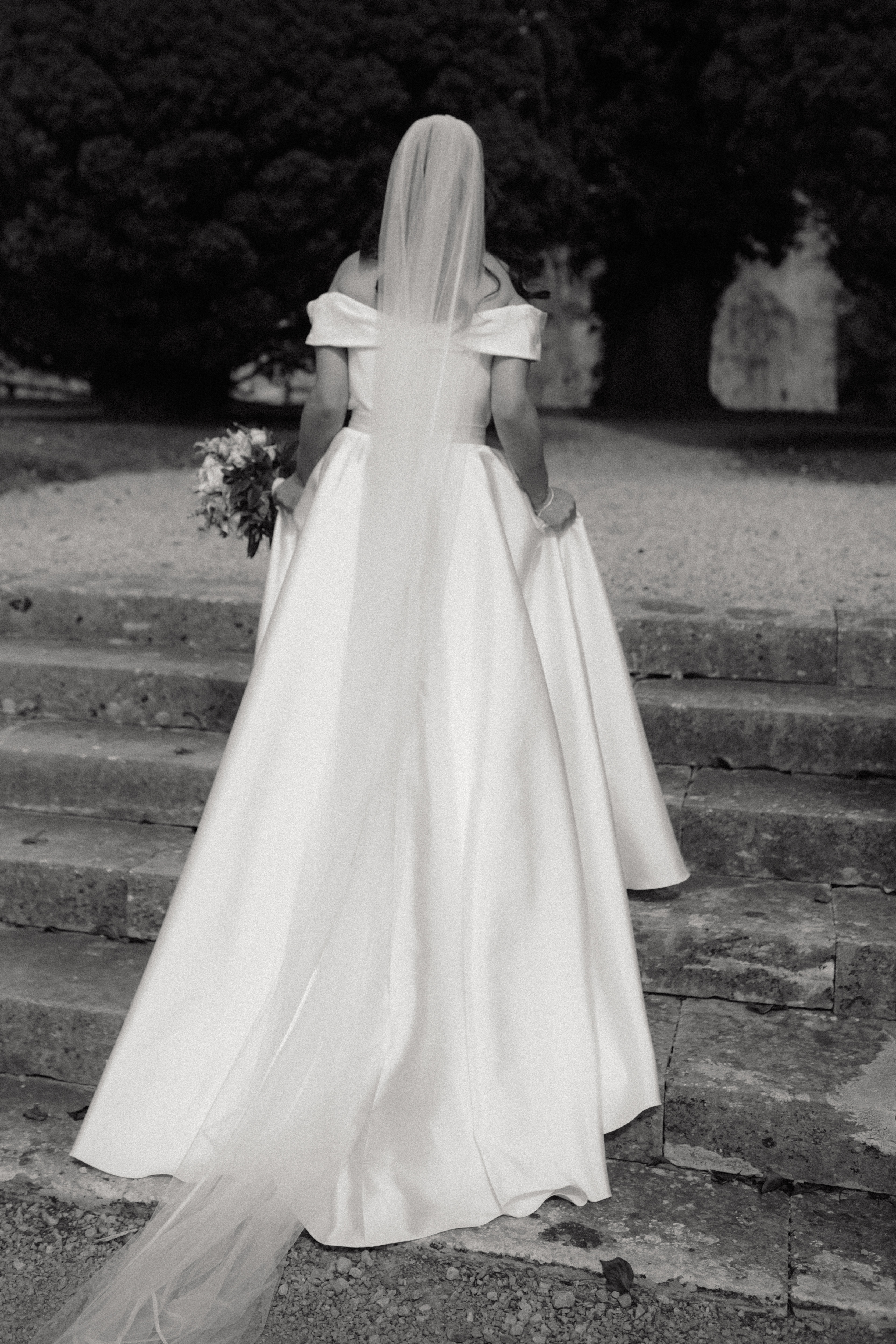 Beautiful rear view of bride in elegant wedding gown